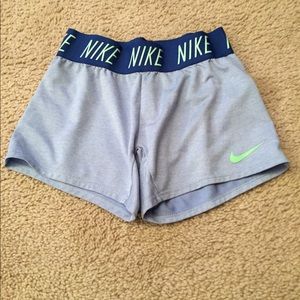 Blue and sea green Nike shorts.